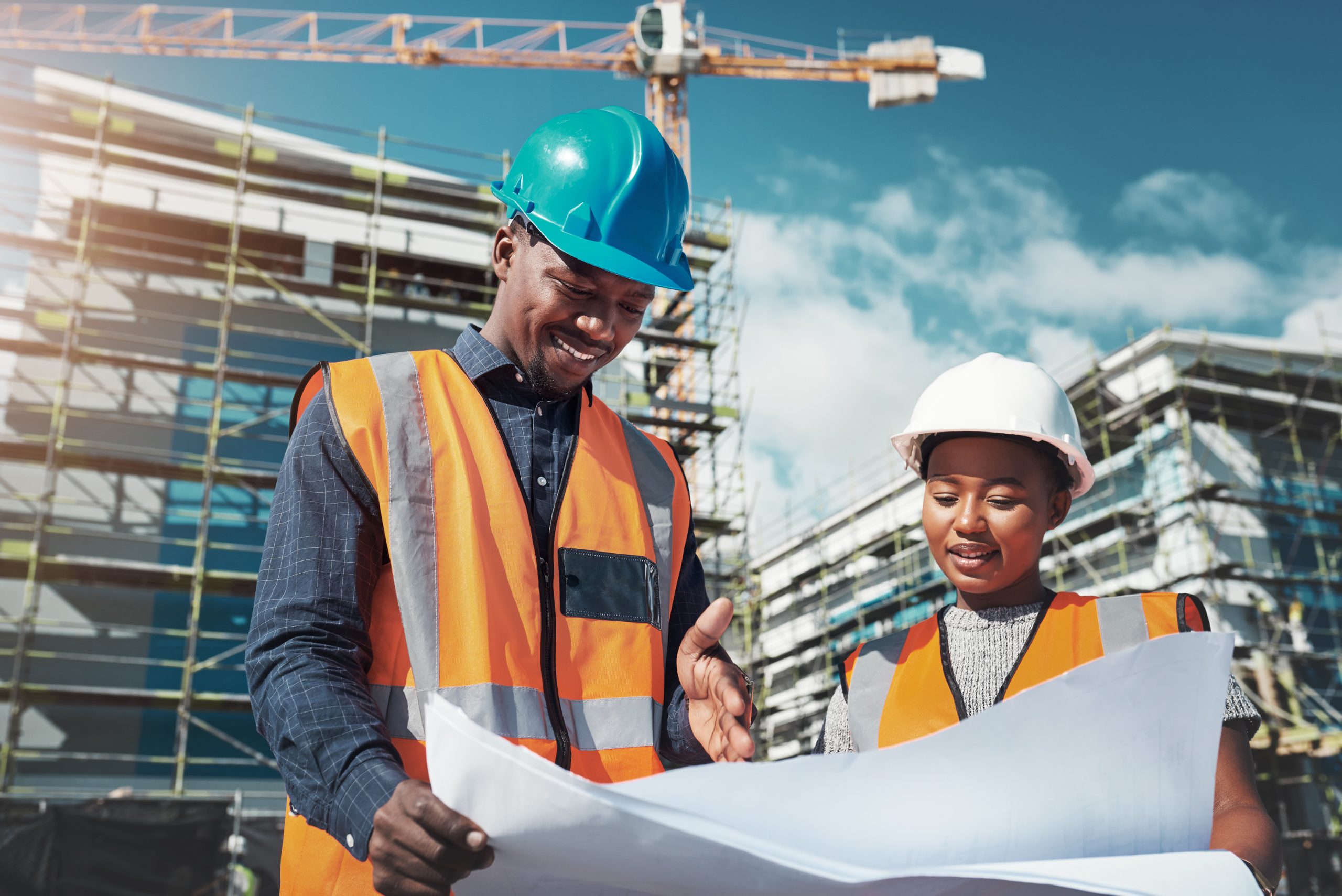 Power Tract construction and engineering team reviewing building plans